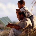 Dad and son with Bible 